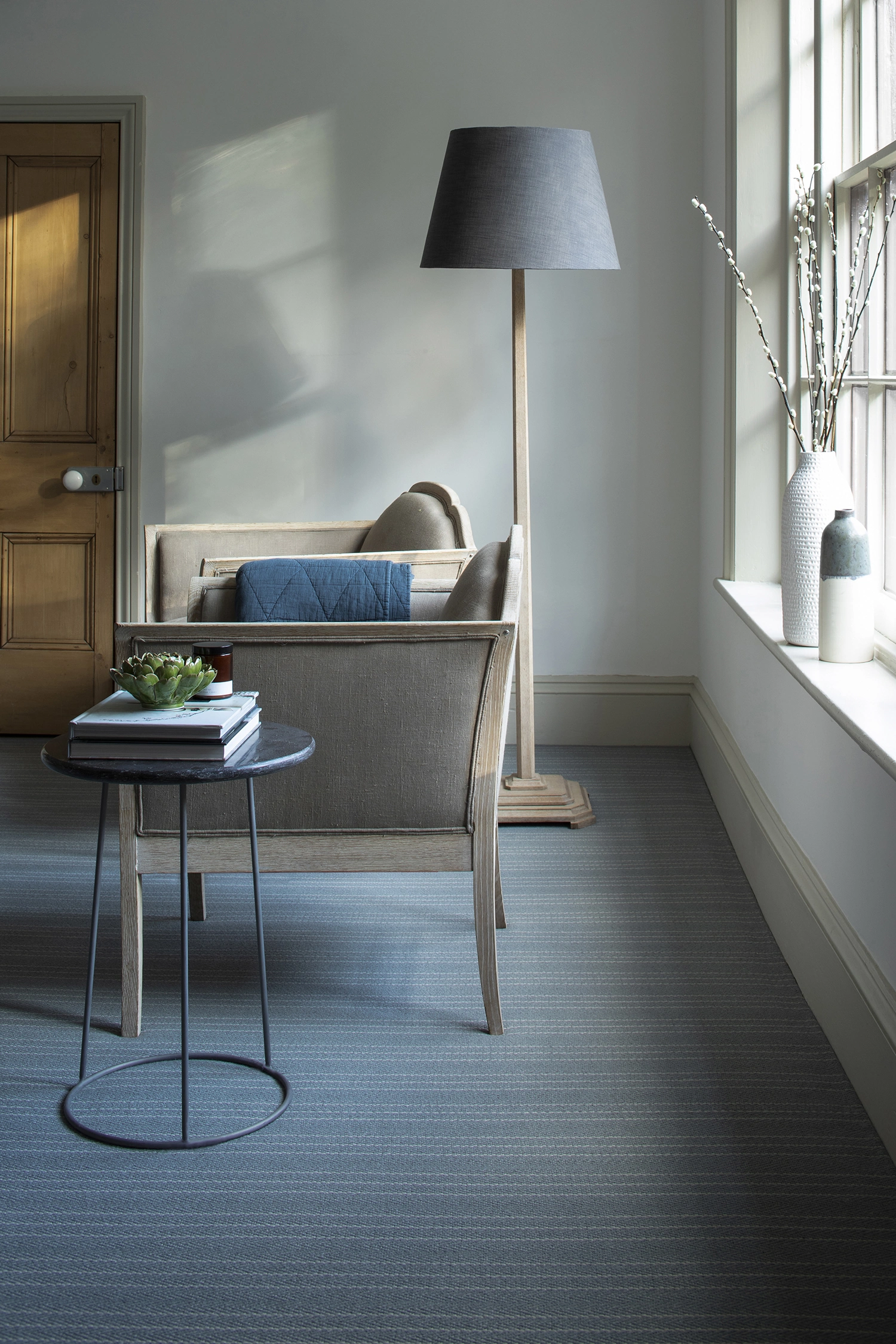A blue and grey carpet in a modern living room