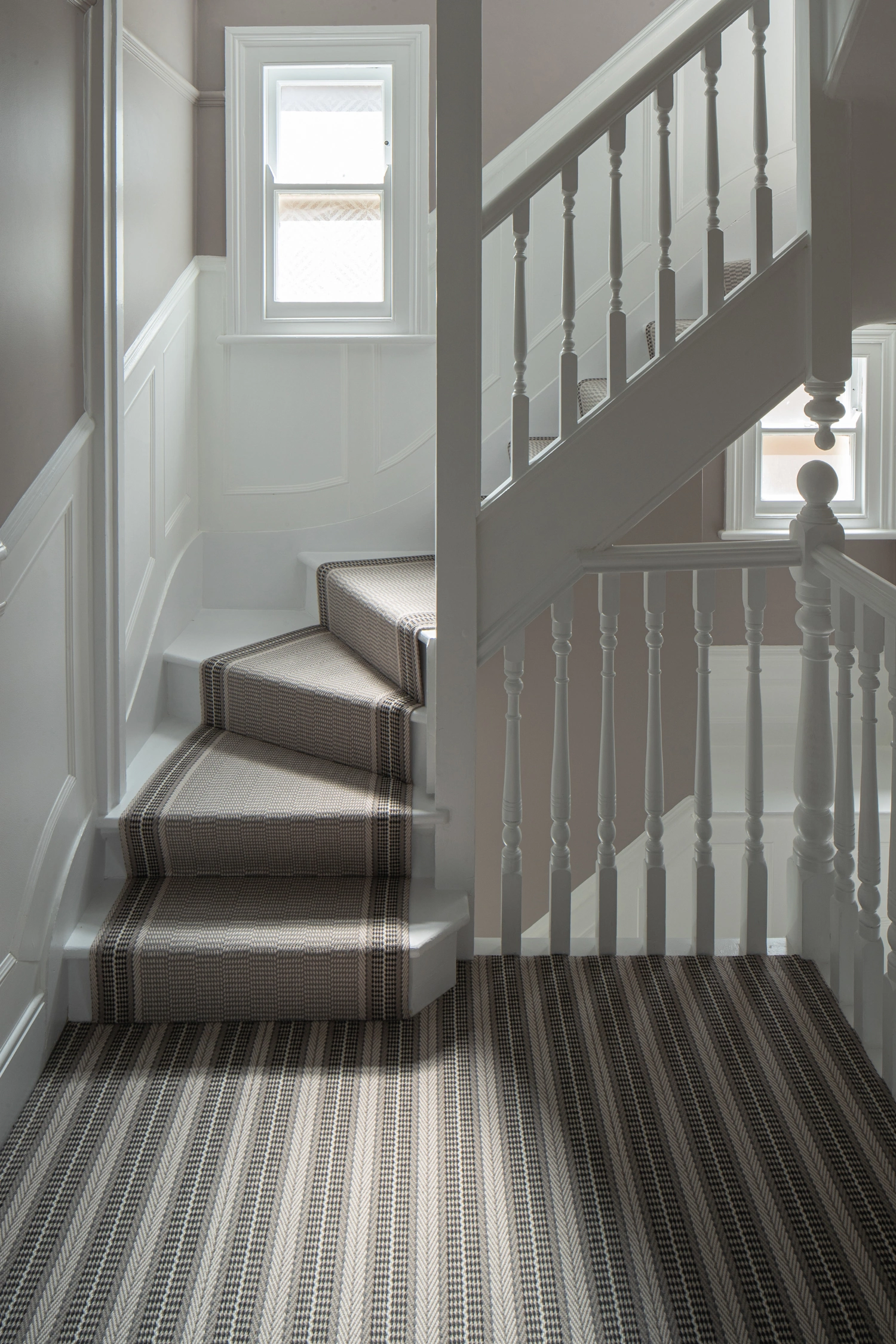 A Roger Oates brown and beige patterned runway carpet